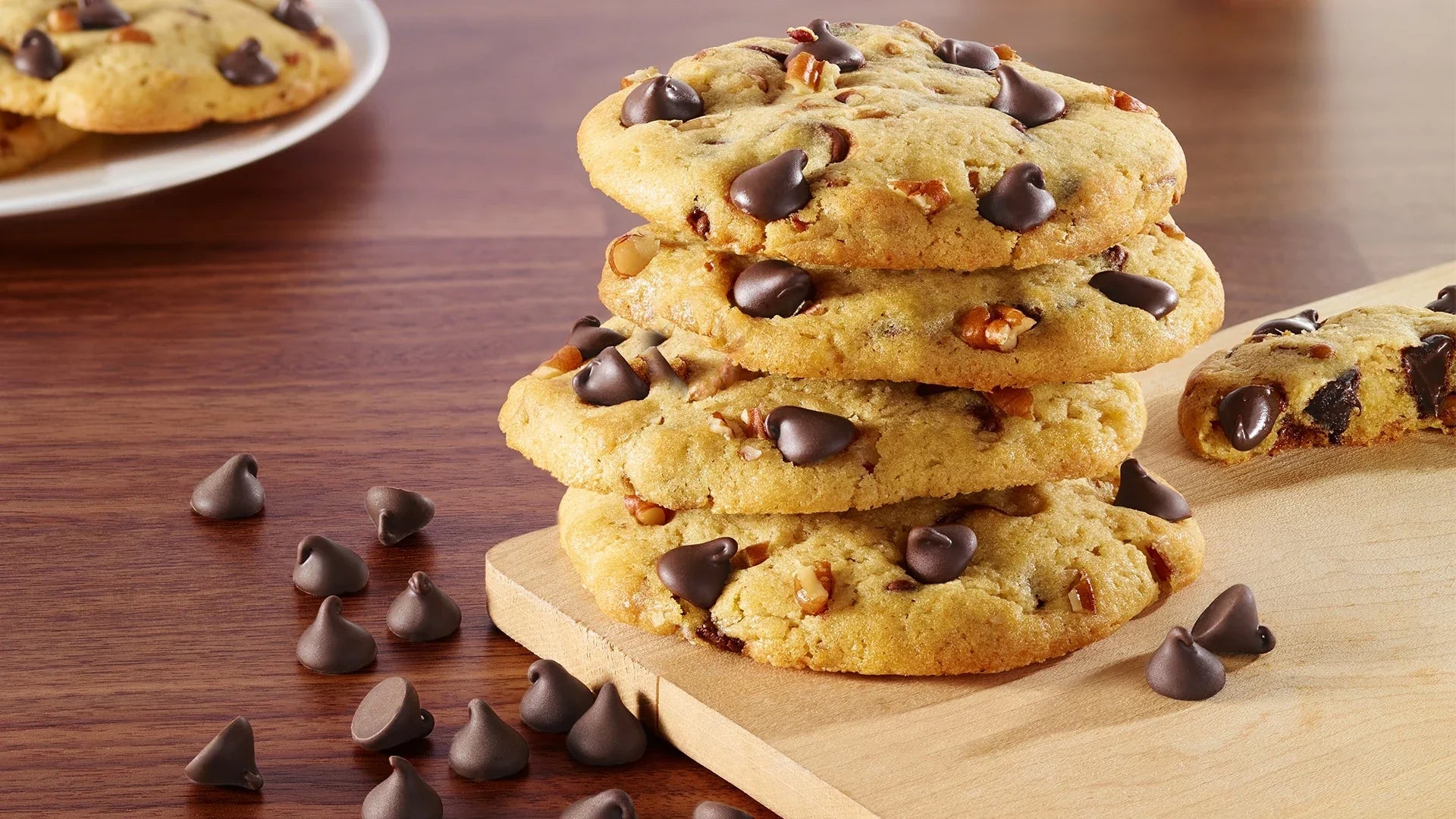 A variety of Voortman Sugar-Free cookies, including chocolate wafers and chocolate chip cookies, artfully arranged on a plate to highlight their tempting appearance and texture.